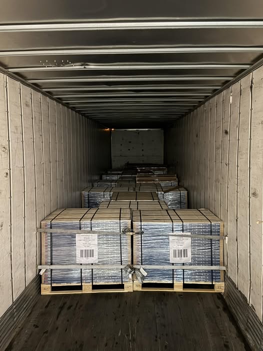 Truck trailer loaded with pallets of SPC flooring for a bulk delivery